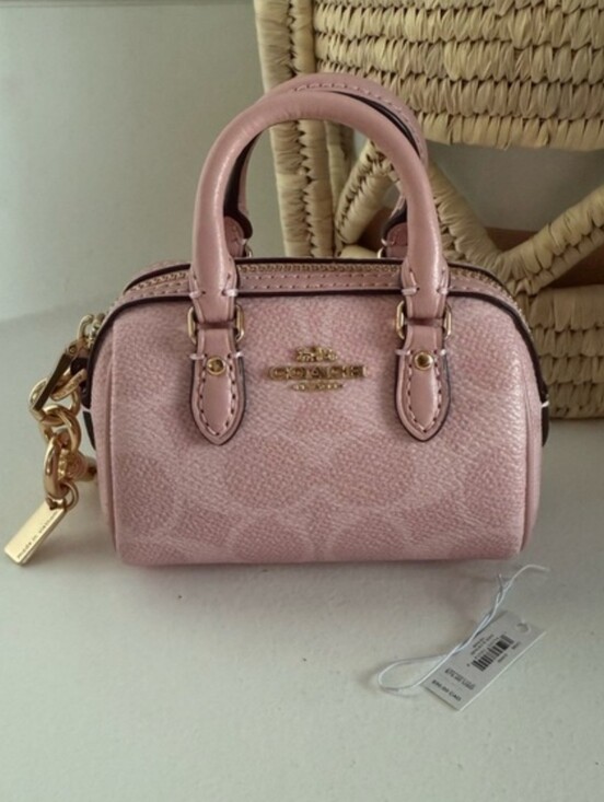 Coach Handbags - Coach Signature Mini Rowan Charm in Powder Pink